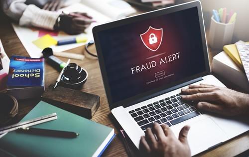 online-loan-scam-fraud-laptop