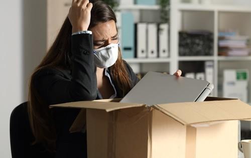 Woman packing a box at office