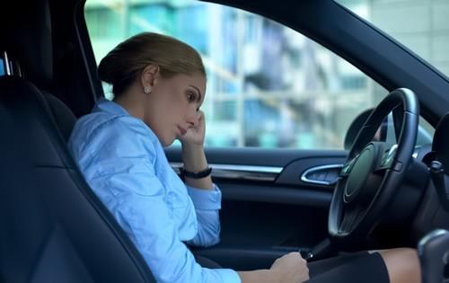 woman-in-car-regret-sad