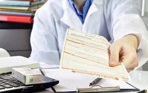 doctor-handing-bill-to-patient