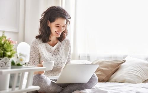 woman-happy-laptop-coffee