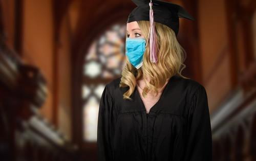 College grad wearing a mask