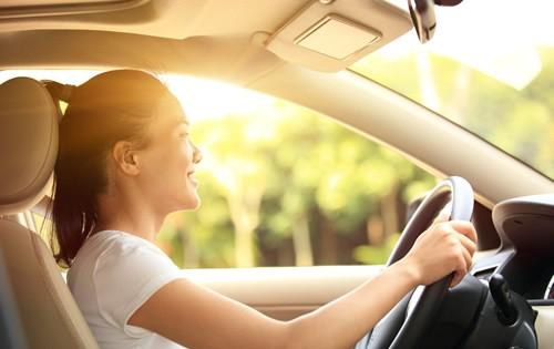 happy-woman-driving-car-paid-off.jpg